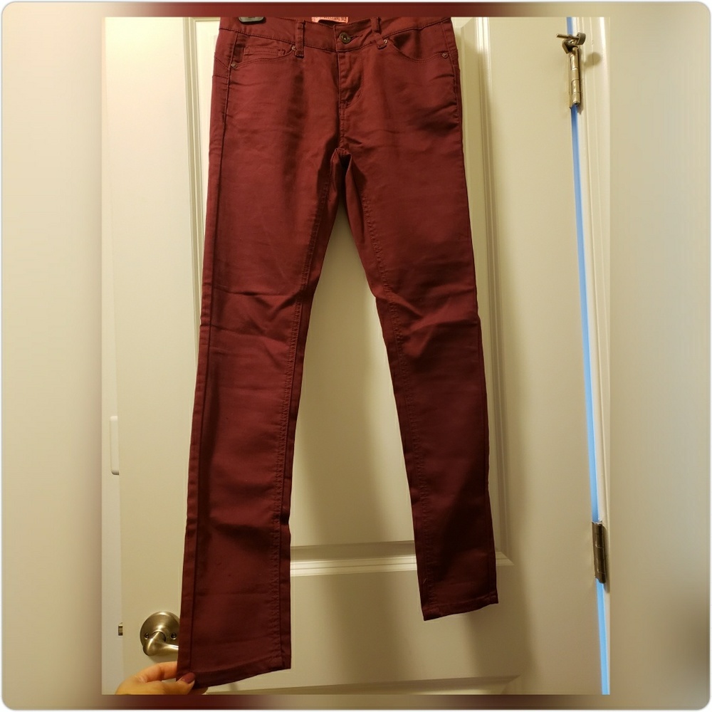 Dark red fitted jean pants. Size 1